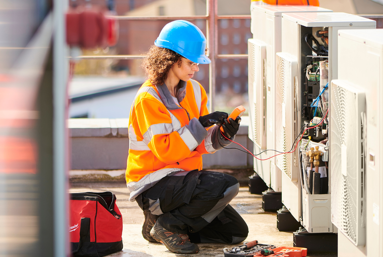 Tradeswoman working on a unit