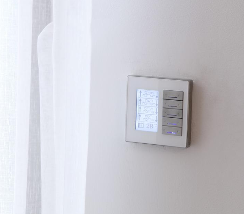 thermostat next to a window